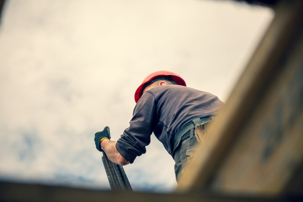 A reliable contractor meeting with homeowners on a construction site, ensuring quality and trust.