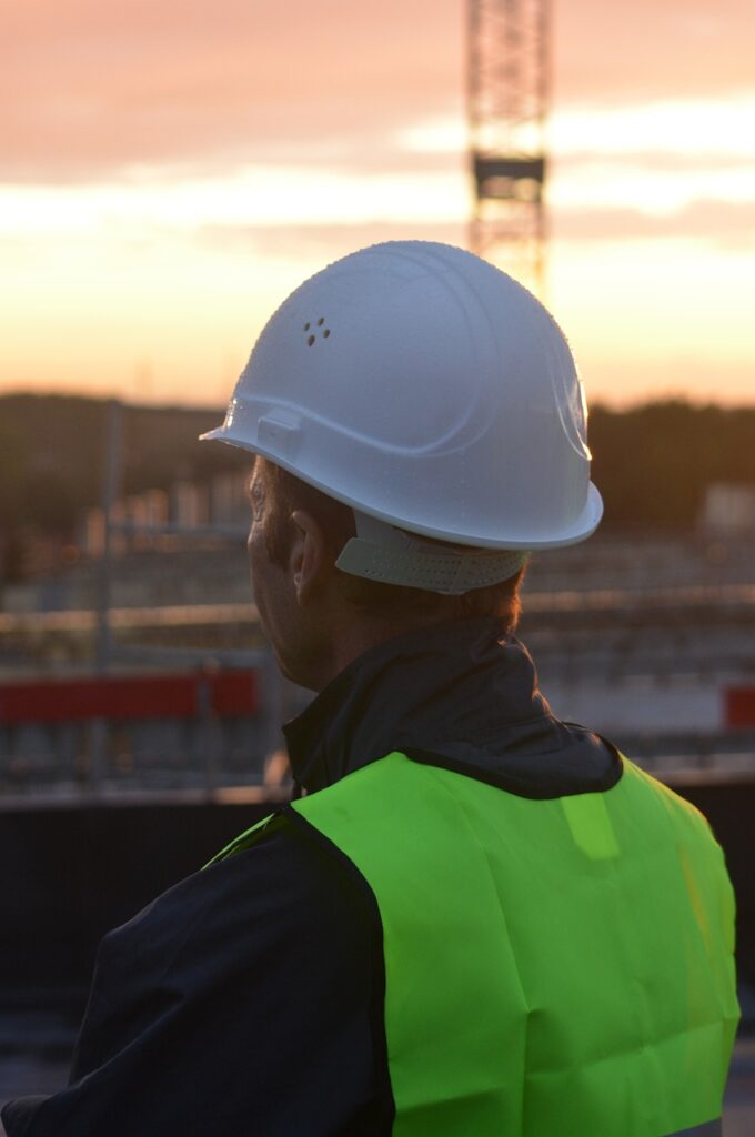A reliable contractor meeting with homeowners on a construction site, ensuring quality and trust.