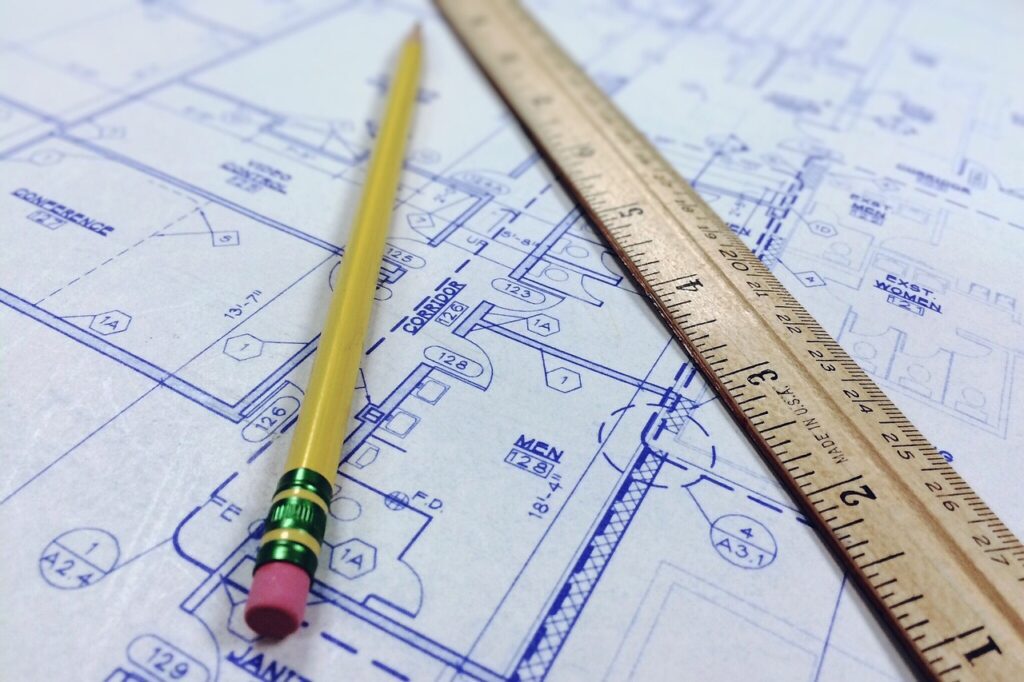 A reliable contractor meeting with homeowners on a construction site, ensuring quality and trust.