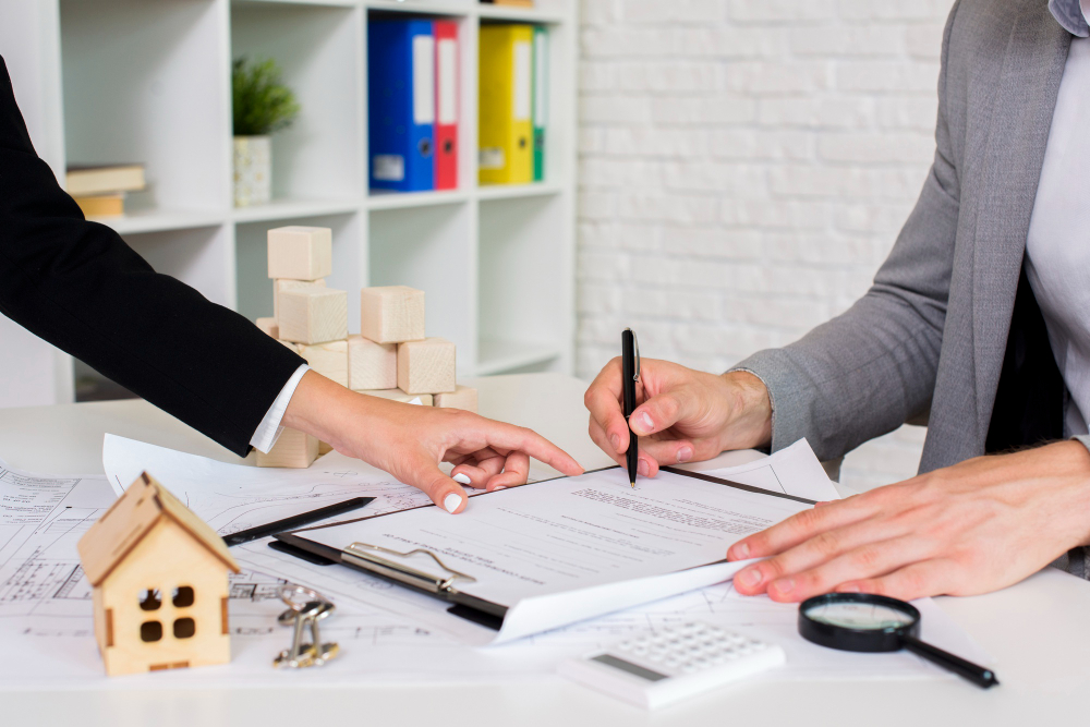 Construction project manager reviewing detailed contracts and documentation to ensure a smooth, dispute-free building process.
