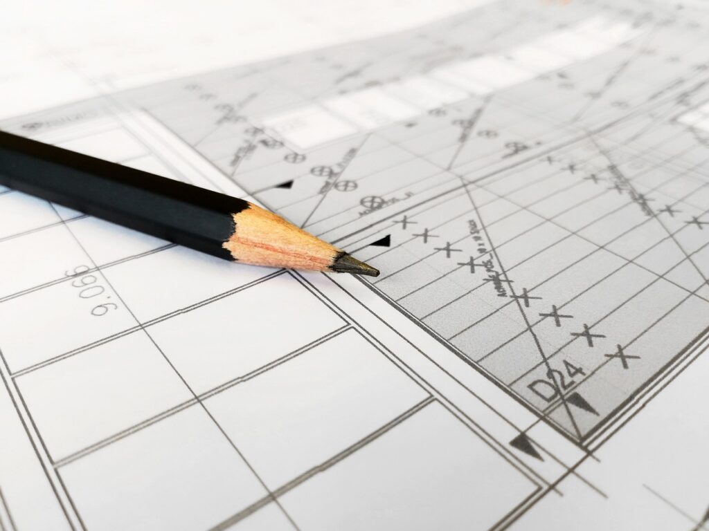 A construction site with builders working under proper warranties and insurance coverage.